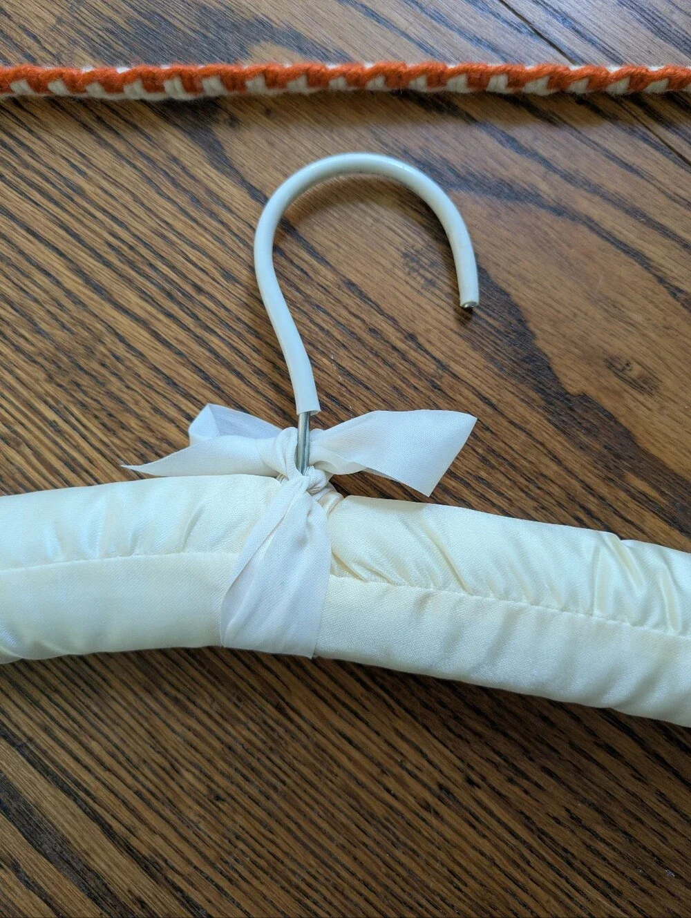 Set Of Two Clothes Hangers, 1 Hand Crocheted, 1 Padded Satin.